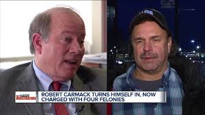 Robert Carmack turns himself in after being charged with felonies