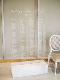 big acrylic seating chart with wood stand modern wedding