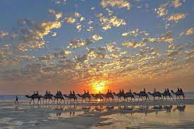 Cable beach swimming, surfing, watching the sunset. 1 Hour Broome Sunset Camel Tour 2021