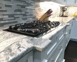 This contemporary kitchen has white cabinets juxtaposed to gray granite countertops. Viscon White Granite Slab For Sale In Lowest Price At Rk Marbles India