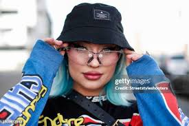 Influencer and Content Creator Naomi Jon wearing a black bucket hat... News  Photo