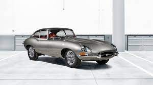 Earlier built cars utilised external bonnet latches which required a tool. Jaguar Revealing First Factory Restored E Type At Techno Classica