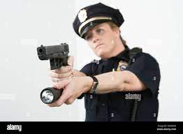 Police Woman Pointing Handgun And Holding Flashlight Stock Photo Alamy