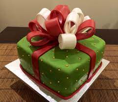 Christmas Present Cake With A Large Bow On Top Carrot Cake With Cream Cheese Frosting Present Cake Fancy Cakes Cake