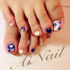 Learn the secret to this blossoming flowers design and put a spring in your client's step. 32 Flower Toe Nail Designs Nail Designs Toe Nail Designs Flower Toe Nails Blue And White Nails