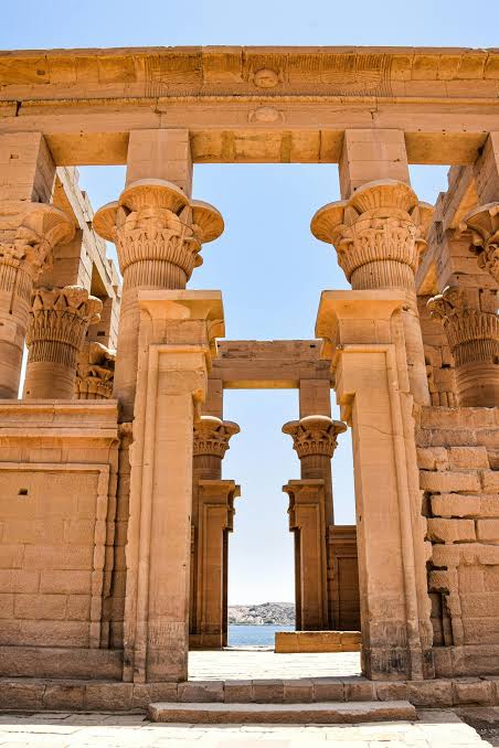 Island Temple of Philae dedicated to Goddess Isis viewed across the Nile waters in Aswan on a private tour