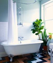 A White Bath In Front Of Mint Green Walls And A Large Window Bathroom Interior Design Vintage Bathrooms Home