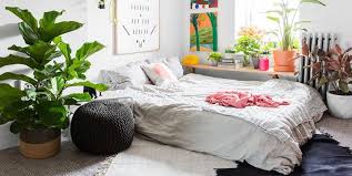 The room also has white flooring with a brown area rug, along with beige walls. Who Says You Need A Bed Frame