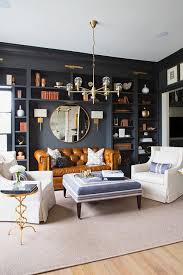 Today, it's symbolic of great taste. Caramel Leather Chesterfield Sofa With Round Brass Mirror Transitional Den Library Office
