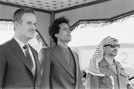 hafez assad president of syria muammar gaddafi former prime minister of libya and yasser arafat former chair muammar gaddafi yasser arafat beautiful men faces