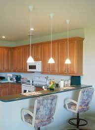 Install the light fixture in the center of your kitchen so illumination is evenly distributed. Low Hanging Mini Pendant Lights Over Kitchen Island For An Apartment Hanging Lights Kitchen Modern Kitchen Over Kitchen Sink
