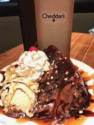 Homemade chocolate chip cookie cooked in a skillet, topped with premium vanilla ice cream, homemade hot fudge, fresh whipped cream, chopped nuts and a cherry. Cheddar S Scratch Kitchen Homemade Meals From Scratch