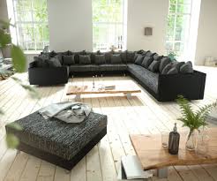 Wohnlandschaft Clovis Schwarz Strukturstoff Mit Hocker