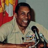 Lieutenant General (LGEN) Frank E. Petersen Jr. (right), commanding  general, Marine Corps Development and Education Center, Quantico, Virginia  (VA), speaks with an unidentified Marine colonel during the officers'Marine  Corps Birthday Ball at