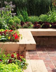 A grass path through a rock garden featuring a large rock fountain. 43 Best Lawn Edging Ideas 2021 Guide