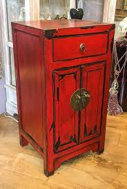 Fine red lacquer cabinet with gold gilt floral motif. Red Lacquered Chinese Cabinet
