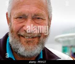 Round-the-world yachtsman Sir Robin Knox-Johnston (right foreground) smiles  as he and his crew sail along the River Thames towards Tower Bridge in  Tracy Edwards' ex-Whitbread Round-the-World yacht Maiden. Sir Robin was in