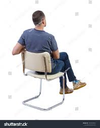 Male character sit and relax indoors. Back View Of A Man Sitting On A Chair Rear View People Collection The Guy Sits Cross Legged Backside View O Man Sitting Sitting Poses Sitting Pose Reference