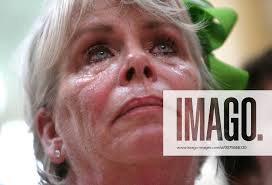 Kathy Neilson of Fairfax, VA, listens as Presidential candidate Sen.  Hillary Clinton