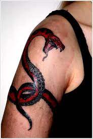 Scary snake tattoose on the leg : 150 Amazing Snake Tattoos Ultimate Guide June 2021 Snake Tattoo Meaning Cobra Tattoo Wrist Tattoos For Women