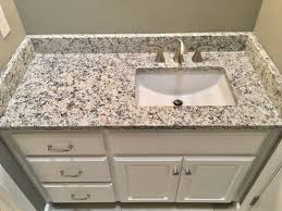 ashen white granite countertops, moen 8