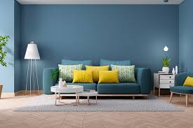 The blue sofa stands out from the rest of the objects that make up this eclectic room. Blue Living Room Design Ideas Design Cafe