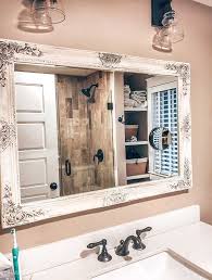 And, the more elaborate the mirror, the heavier it will look. Beautifully Framed Bathroom Mirrors Hallstrom Home Shabby Chic Bathroom Bathroom Mirror Frame Cottage Bathroom Mirrors