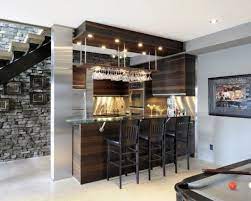 Depending on the size of the bar top and the number of bottle caps, you can create designs and color gradients that will liven up even the dullest bar top. 40 Inspirational Home Bar Design Ideas For A Stylish Modern Home Modern Home Bar Designs Modern Home Bar Home Bar Designs