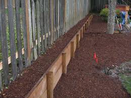 The gardeners of the internet have come up with plenty of cool, innovative ways to create gardening beds that are both highly functional and attractive, and to be honest, we're probably going to borrow a few of these ideas to use in our own gardens! Long Raised Bed Great Way To Go Vertical Along Fenceline Property Building A Raised Garden Raised Flower Beds Flower Beds