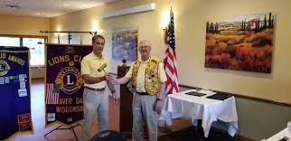 Outgoing President Lion John...