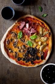 Quattro Stagioni Four Seasons Pizza Recipe Made With Artichokes Mushrooms Ham And Olives An Authentic Italian Recipes Seasons Pizza Italian Dinner Recipes