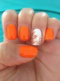 We love the contrast between this bright, shiny orange colour and the matte pale yellow in the half moons. 55 Trendy Manicure Ideas In Fall Nail Colors Orange Nail Art Trendy Nails Summer Nails 2014