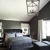 Design ideas for a contemporary bedroom in london with black walls, carpet, no fireplace, beige floors and wallpapered walls. 1