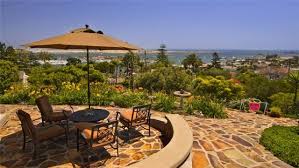 A stellar water feature comprised of corten steel is the focal point of this patio and pool area by aguafina gardens international. 21 Eye Catching Flagstone Patio Design Ideas