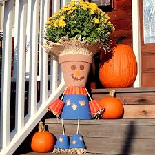 Turn Terra Cotta Pots Into A Charming Scarecrow Video Video Fall Crafts Flower Pot Crafts Fall Diy