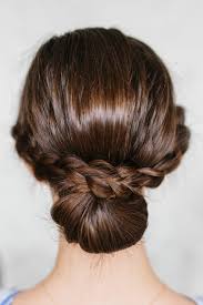 Spritz with a little hairspray, and you are ready to cheer on your team! How To Do A Braided Bun Hair Tutorial The Effortless Chic