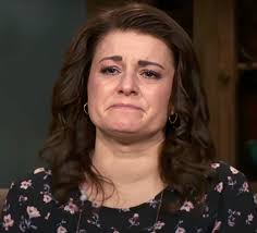 Why does Aurora look different in the face and why was she holding a pillow  sitting down when talking to Robyn and Kody?