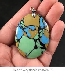 It is composed of quartzite, and the black spots are flakes of chlorite. Beautiful Oval Shaped Yellow Green Black And Blue Synthetic Stone Pendant By6wbec6kaw