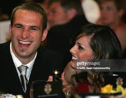 Shane Crawford of Hawthorn and partner Olivia Andersen arrive for the...  News Photo