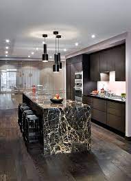 Engineered quartz and natural marble are a beautiful duo in this stylish black and white cooking space by homepolish designer, natalie chianese. Show Off The Veining Of Your Marble Countertop And Make Simple Wooden Cabinetry Sparkle Granite Kitchen Island Kitchen Interior Modern Modern Marble Kitchen