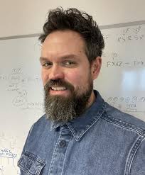 Greg Findlay promoted to Reader