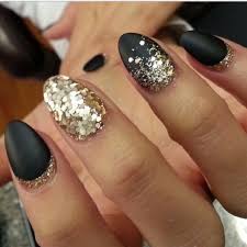 Matte Black And Gold Glitter Nails Matte Black Almond Shaped False Nails With Gold Glitter Detailing These Can Be Done In Stiletto Or Square Sh Black Gold Nails Gold Nails Almond Acrylic Nails