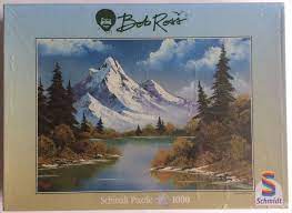 If you like puzzles and have wanted to enjoy one of bob ross ' paintings on your table or wall, you're in luck. 1000 Schmidt Mountain Reflections Bob Ross Rare Puzzles Mountain Reflection Bob Ross Puzzle Art