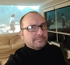 What do you think the character's identity is in the 'Wash' scene?