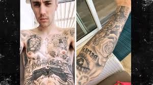 The pop star talked to gq about the stories behind his many tattoos. Justin Bieber Shows Off His Countless Tattoos Honk News