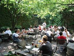 Another One With Pavers The Chairs Are Pretty Crazy Too Not Sure I Like Them They Remind Me Of Hubcaps But They Beer Garden Great Dane Beer Garden Ideas
