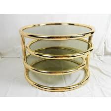 The metal latch opens its two doors to reveal a large cubby of storage as well as two drawers. Milo Baughman Style Tri Level Swivel Brass Coffee Table Chairish