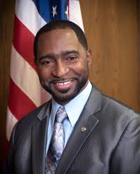 Small protest draws attention as police juror's comments draw ire