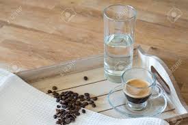 Check spelling or type a new query. Immagini Stock Bicchiere Di Caffe Espresso Un Bicchiere D Acqua E Chicchi Di Caffe Su Un Vassoio Di Legno Image 62263488