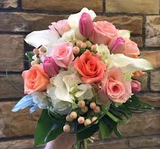 The bouquets resemble a small bridesmaid bouquet, and can be designed in a plethora of colors and styles. The Enchanted Petal May 2016